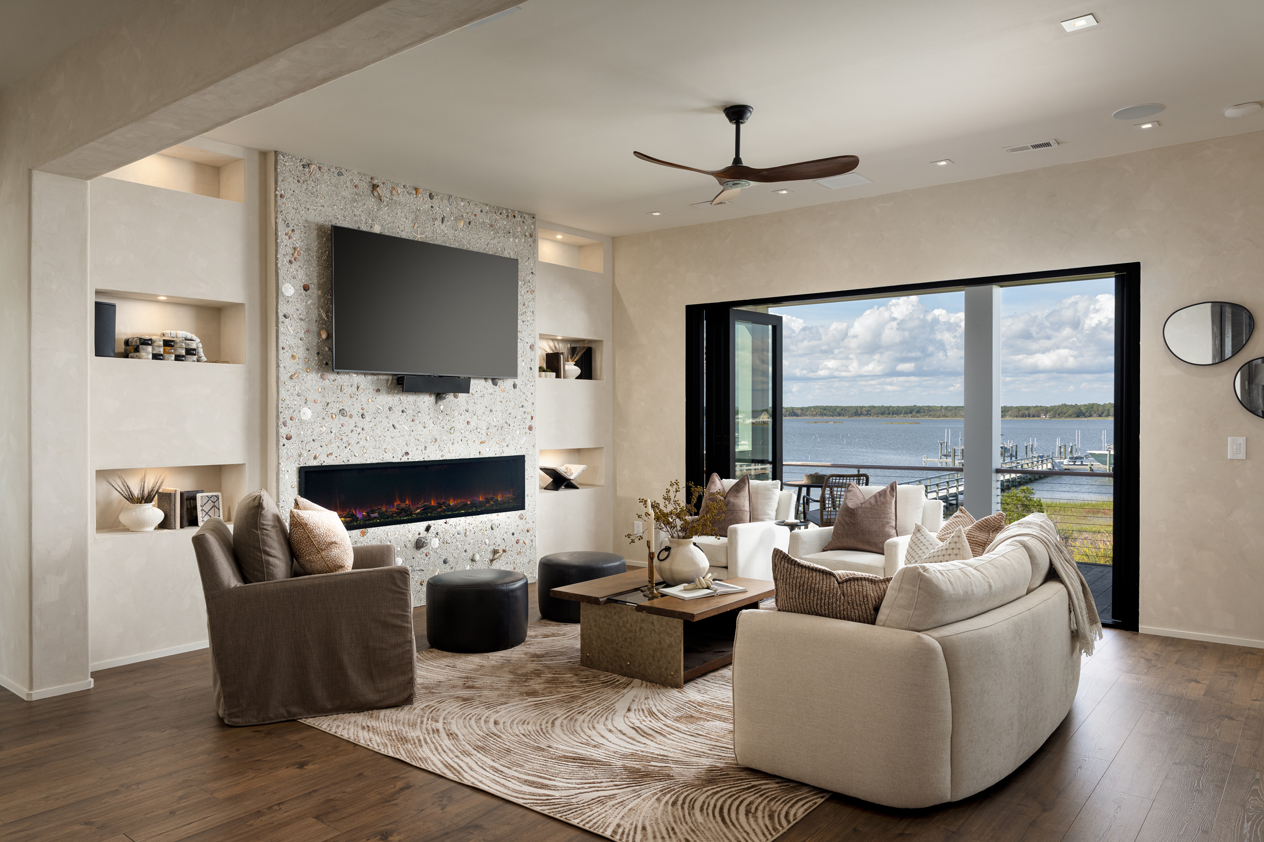 Living room with fireplace and water views